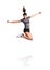 Young fitness woman jumping high. Studio shot, isolated.