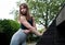 Young fitness woman posing while stretching against a inclined roof