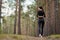 Young fitness woman running at forest trail.