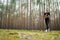 Young fitness woman running at forest trail.