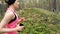 Young fitness woman running at pine tree forest trail