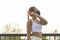 Young fitness woman in sportswear taking face mask off while exercise in city park, Health and Lifestyles