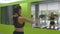 Young fitness woman training in front of the mirror at the gym. Female athlete stretching her body and hands before