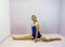 Young flexible transgender girl preforming a side split on the floor for acrobatic gymnastics