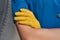 Young flight attendant wearing a leather glove