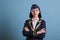 Young flight attendant wearing uniform standing with crossed arms