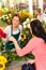 Young florist ordering roses woman customer flower