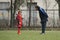 Young football player and his coach