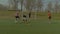 Young footballer scoring a goal during match