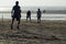 Young Footballers and athletes playing football on beach