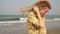 Young free happy hippie woman with dreadlocks hair at the sea beach