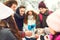 Young friends drink tea in the park in winter