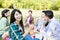 young friends enjoying healthy picnic