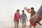 Young Friends Flying a Kite on the Beach