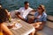 Young friends partying on a boat