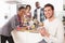 Young Friends Preparing Breakfast In Kitchen