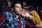 young frightened couple with popcorn watching horror movie