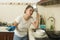 Young frustrated Asian woman in domestic chores stress - beautiful overwhelmed and stressed Japanese girl washing dishes in