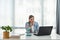 Young frustrated business woman office worker trying to concentrate for her work while she sitting in the company office with old