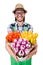 Young funny gardener with tulips isolated oin