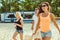 Young funny guys in sunglasses on the beach. Friends together.