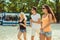 Young funny guys in sunglasses on the beach. Friends together.