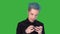 Young funny man plays a mobile game. Emotions. Playing games on green screen.