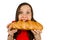 Young funny pretty woman eats long loaf isolated on a white background