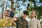 Young gay couple smiling happy making selfie by the smartphone at the city