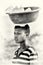 Young Ghanaian woman carries a basin with cold wa