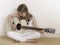 Young Girl on a Acoustic Guitar