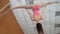 Young girl acrobat shows flexibility on gymnastic hoop