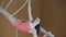 Young girl acrobat shows flexibility on gymnastic hoop