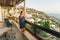 Young girl admiring beautiful landscape from the balcony