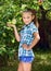 Young girl in an apple orchard