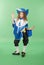 Young girl as a musketeer in blue costume with lovely blue hat with feathers