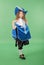 Young girl as a musketeer in blue costume with lovely blue hat with feathers