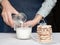 Young girl baked a fragrant biscuit, decorated it and poured