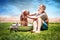 Young girl bathing her dog and kitten outside and kitten