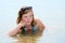 Young girl bathing in the sea.