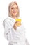 Young girl in a bathrobe holding an orange juice