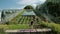 Young girl in black sportswear doing yoga outdoors, performs various exercises