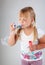 Young girl blow out soap bubbles