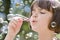 Young girl blowing bubbles