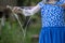 Young girl in blue and white dress with large bubble