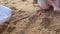 Young girl build sand castle on beach