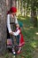 Young girl in Bulgarian dress posing with her Mother