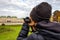 Young girl with camera is taking a photo at Schloss Belvedere in Vienna.