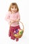 Young Girl Carrying Basket Filled With Easter Eggs