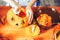 Young girl carving a pumpkin at Halloween